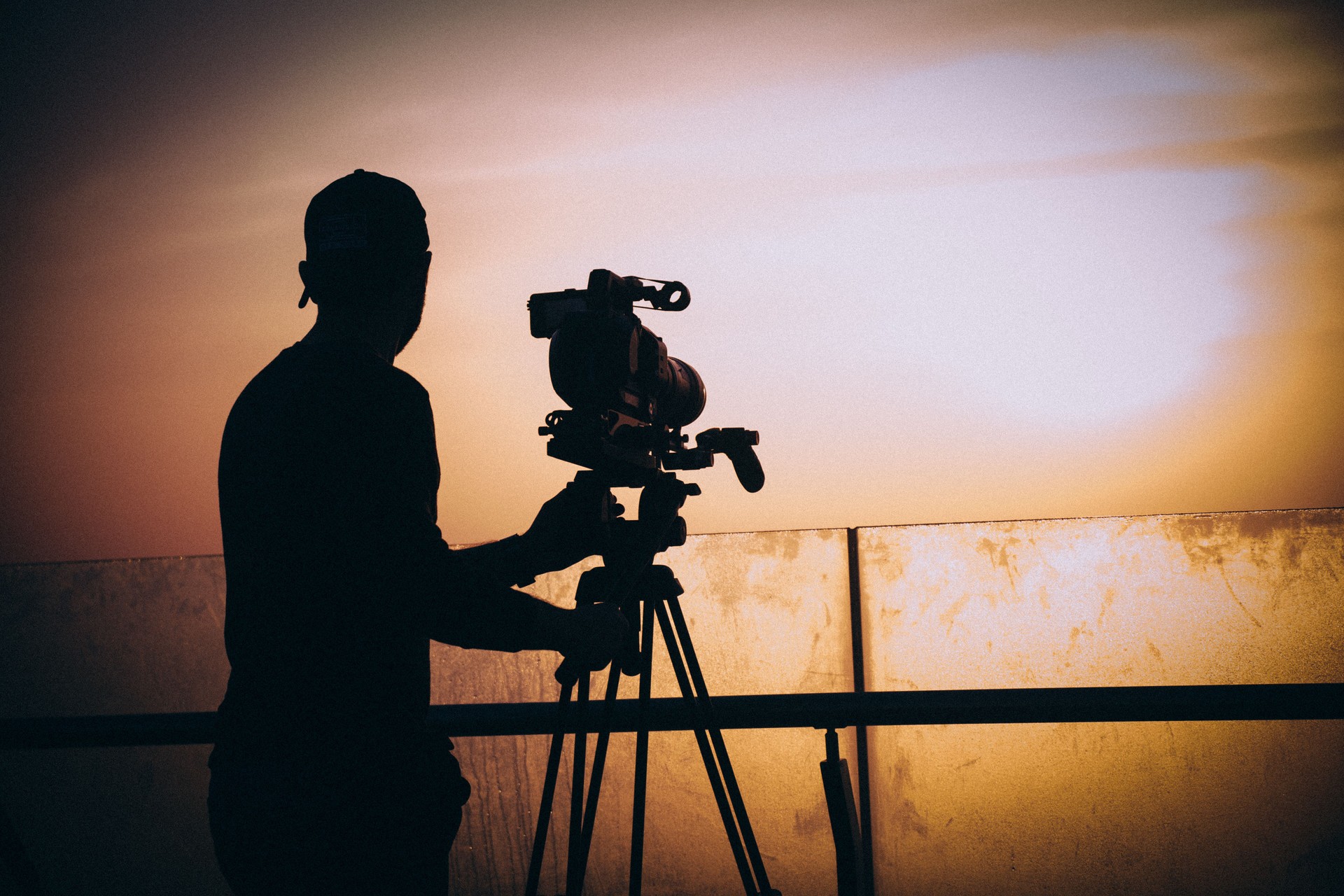 Filmmaker capturing sunset